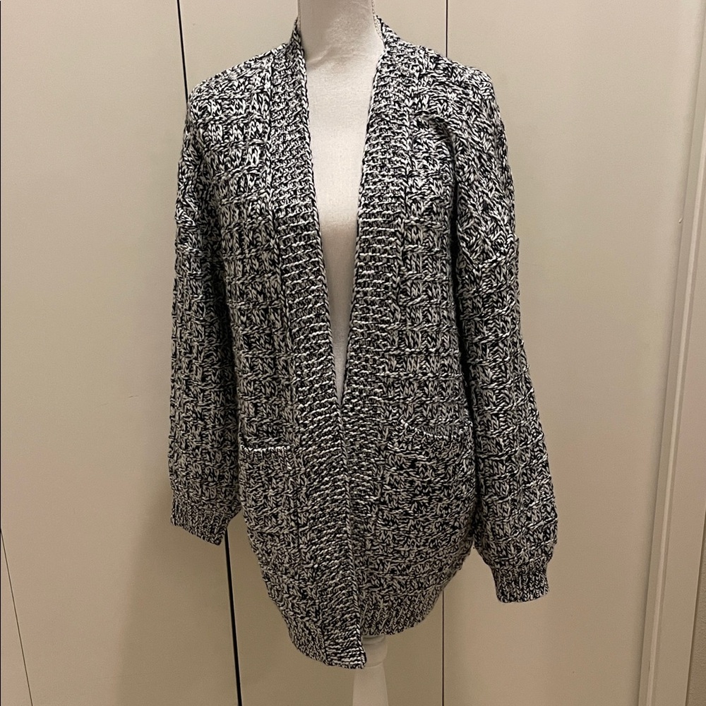 Skies are blue black and white cardigan size M